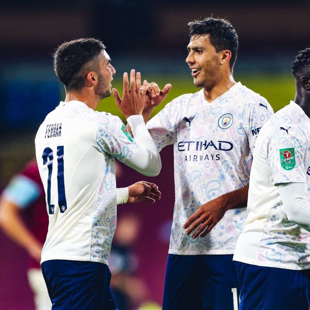 Torres celebrating debut goal with teammate Rodri. Manchester  City won the match 3:0 to progress to the quarter finals of EFL, Carabao cup