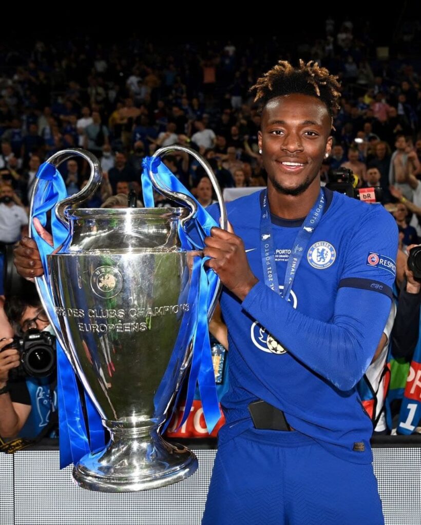 Tammy Abraham holds up the Champions League trophy following their Champions League win after beating Guardiola's City, 1-0 in 2020/21 season.