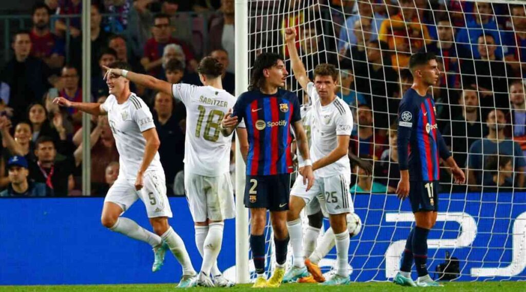 Bayern's Benjamin Pavard, left, celebrates after scoring his side's third goal during the Champions League Group C soccer match between Barcelona and Bayern Munich at the Camp Nou stadium in Barcelona, Spain, Wednesday, Oct. 26, 2022. (AP Photo/Joan Monfort)