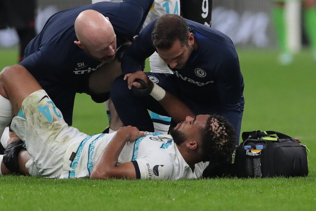 Chelsea's Reece James lying down injured in the game against AC Milan. Photo Credits: Emilio Andreoli/Getty Images