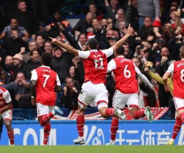 Arsenal players celebrating their goal against Chelsea