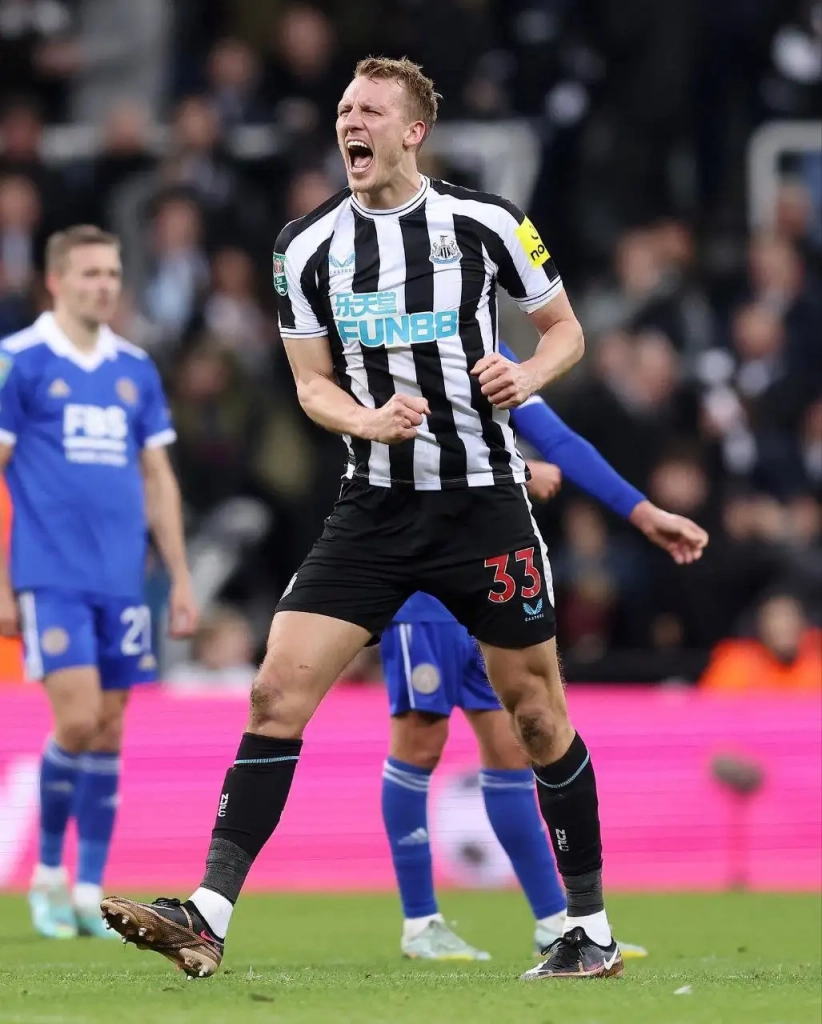 Dan Burn celebrating their victory against Leicester City in a past match. Newcastle are currently in third place, almost certain of a Champions League spot next season